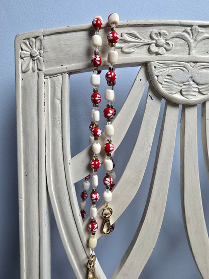 Bandoulière Rosa en Corne et perles dans les tons du Rouge